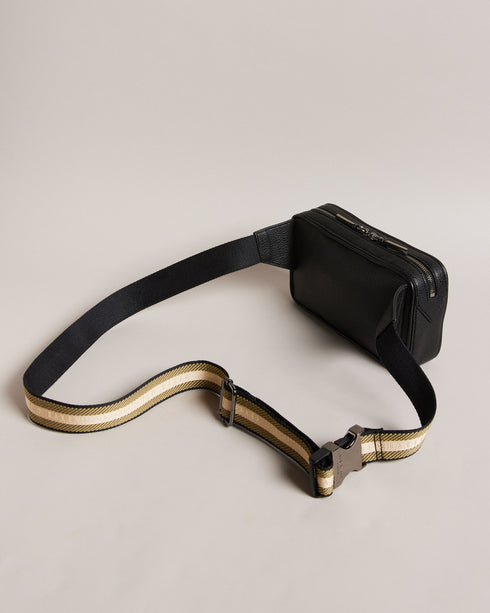 FABE-Bags-Introducing FABE, the faux leather belt bag that combines style and convenience in one sleek package. This hands-free hero keeps your essentials by your side whether you're exploring a new city or dancing the days away through festival season. Belt bag Faux leather Adjustable webbing strap Zip fastening Side release buckle Dimensions: 5cm x 12.5cm x 22.5cm- Ted Baker Romania